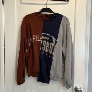 Urban Outfitters women’s small patchwork long-sleeve sweatshirt.